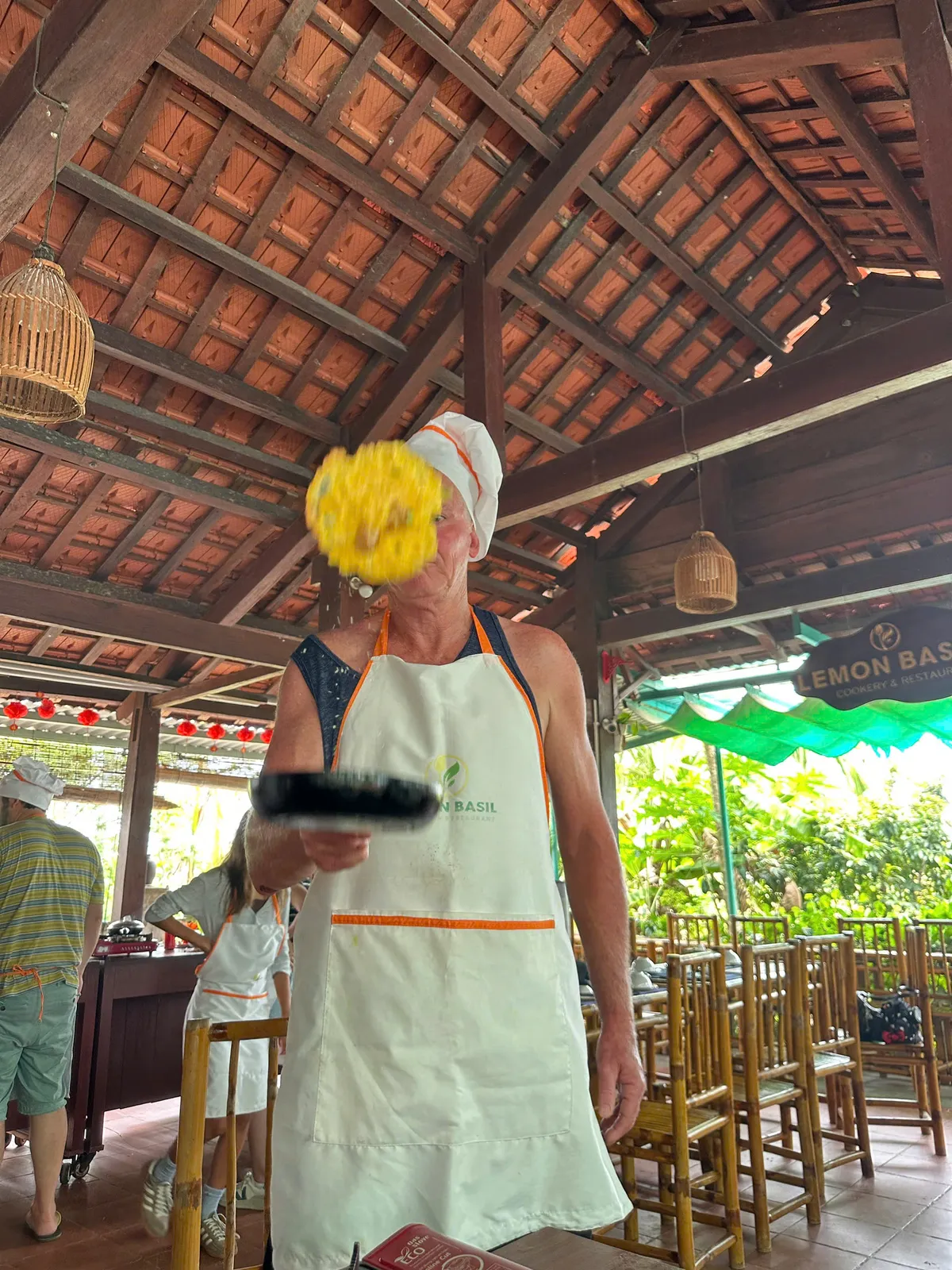 Cooking crispy Banh Xeo Vietnamese pancakes in Hoi An class
