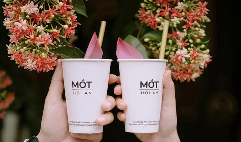 best photo spots in Hoi An Mot herbal tea cup with lotus petal check-in